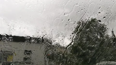 Rain falling on windhield of car 스톡 동영상 160817764