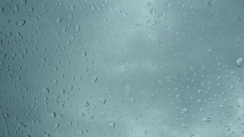 Rain falling on a window from the back side Stock Footage 132838698