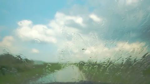 Rain falling on the window of the car Stock Footage 111056971