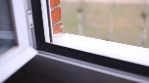 Rain falling on a window Stock Footage 128984923