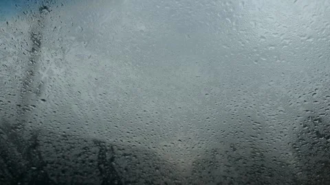 Rain falling on window glass timelapse Stock Footage 330743237
