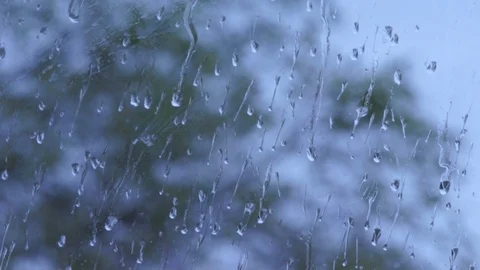 RAIN FALLING ON WINDOW STATIC SLOWLY Stock Footage 100205566