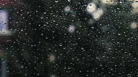 Rain falling on the window surface Stock Footage 136198806