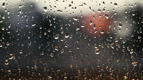 Rain falling on the window surface Video stock 136774219