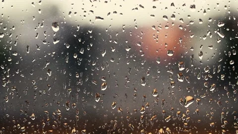 Rain falling on the window surface Stock Footage 136774823