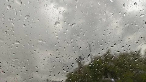 The rain is falling on the windshield of a car Stock Photos