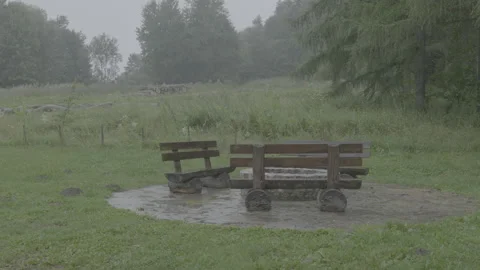 Rain Falling on Wooden Benches at a Rest Area in Bieszczady, Poland Stock Footage 342558726