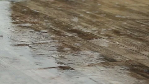 Rain falls on brown pavement tiles Stock Footage 135319568