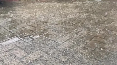 Rain falls on Colorful Geometric Pattern Textured Floor Stock Footage 260009222