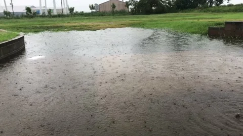Rain Falls Onto Flooded Loading Dock Area TN/KY Border Town 4K Stock Footage 202212220