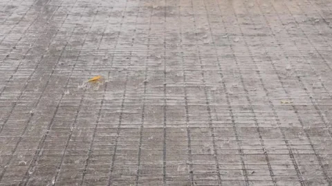 Rain falls on the ground tiles in the backyard outside the house. Stock Footage 278035871