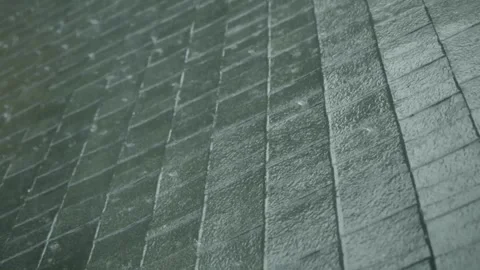 Rain falls heavily on the rooftops from passing storm.Macro Video Slow Motion. Stockbeeldmateriaal 336571303