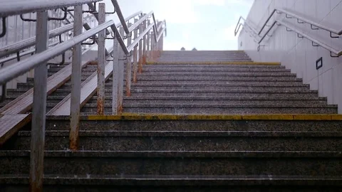 The rain falls in large drops on the stone steps. HD, 1920x1080. Slow motion Stock Footage 78190126
