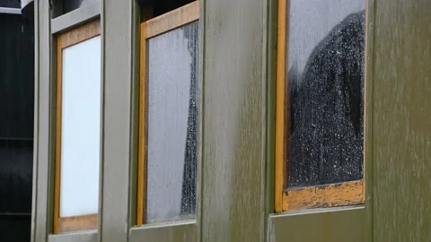 Rain falls on old passenger train wagon Stock Footage 172012817