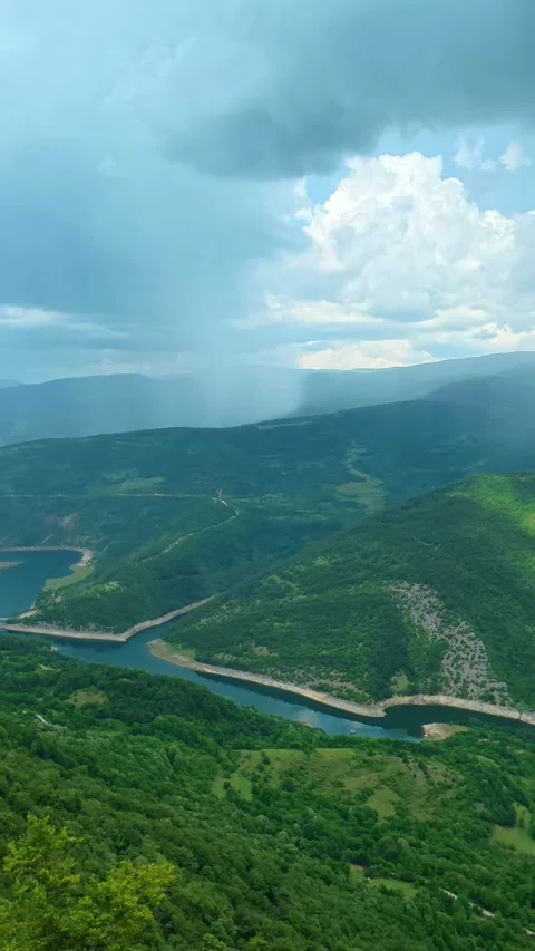 Rain falls over a winding river valley. Kozji Kamen viewpoint, Vertical 스톡 동영상 341882243