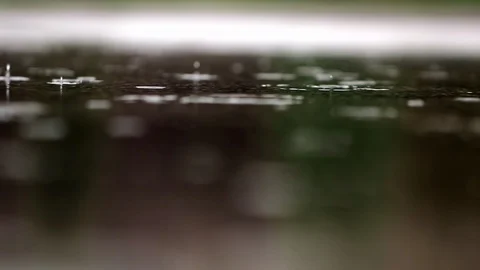 Rain falls in a puddle. Bubbles in a puddle Stock Footage 116873894