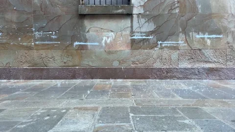 Rain falls on road bricks Video stock 224882717