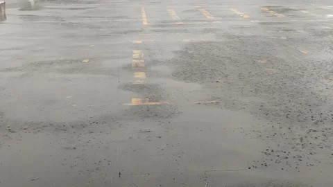 Rain falls on the road during the rainy season when vehicles travel 스톡 동영상 250474501