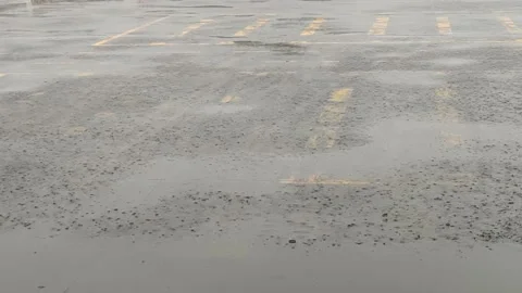 Rain falls on the road during the rainy season when vehicles travel Stock Footage 250474503