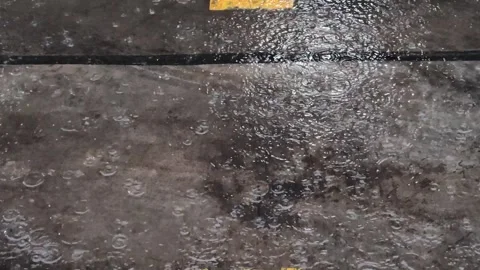 Rain falls on the road during the rainy season when vehicles travel 스톡 동영상 250474509