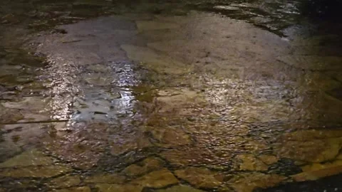 Rain falls on the stone floor at night Video stock 271392565