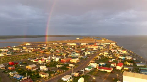 Rain falls as sun shines in the middle of the night at Kotzebue Alaska creating  Video stock 136016624