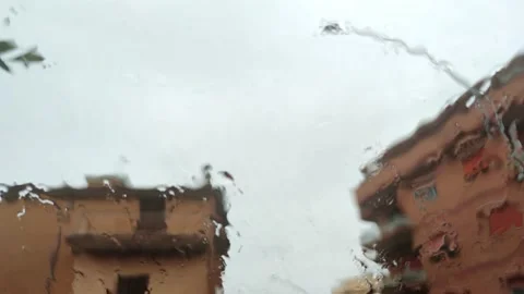Rain falls on the windshield of a car Stock Footage 160280188