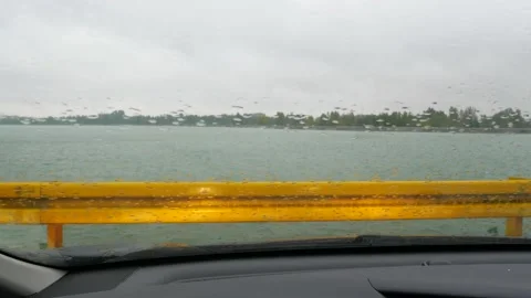 Rain falls on windshield of a car standing Stock-Footage 167700820