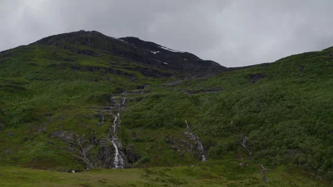 Rain-Fed Streams Running Down Steep Hillside in Norwegian Fjordland Stock Footage 342078436