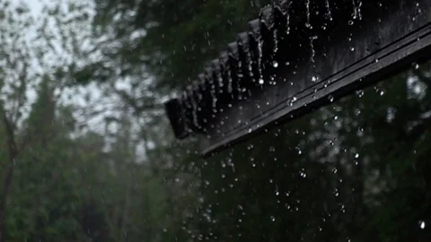 Rain flow from the eaves to the ground in Slow Motion Stock Footage 109300167