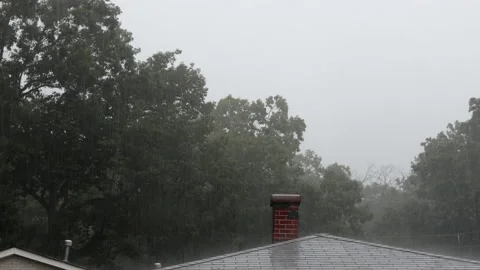 Rain flowing down on the summer storm and rain drops on the roof in the town Stock Footage 135366677