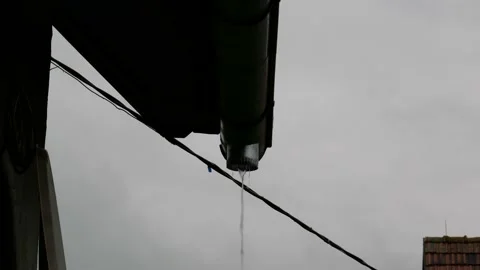 Rain flowing through the missing gutter Stock Footage 155567691