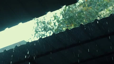 Rain flows down from a roof down Stock Footage 136409471