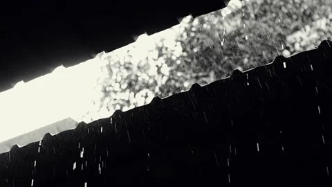 Rain flows down from a roof down Stock Footage 136411588