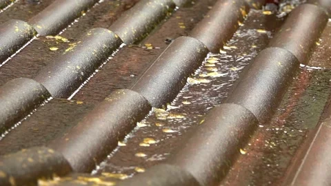 Rain flows down on a roof Stock Footage 155847620