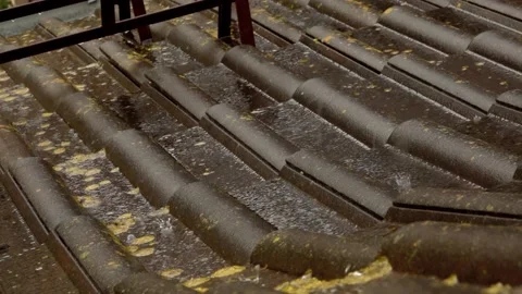 Rain flows down on a roof Stock Footage 155847892