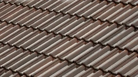 Rain flows down on a roof Stock Footage 155847954