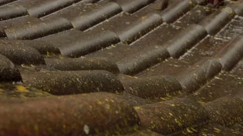 Rain flows down on a roof Stock Footage 155848007