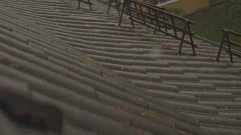 Rain flows down on a roof Stock-Footage 245478390