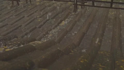 Rain flows down on a roof Stock-Footage 245478402
