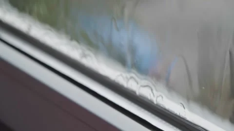 Rain flows down the window. Raindrops flow down the glass, close-up. Rain flows Stock Footage 262534425