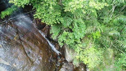 Rain forest waterfall pull out ascending  Aerial Video 4K Stock Footage 96774609