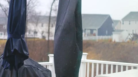 Rain gently falls in a suburban backyard, creating a serene atmosphere. Video stock 302117658