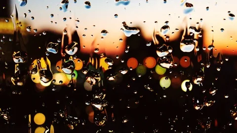 Rain on glass with blurry background looping animation 2 Stock Footage