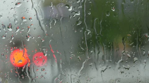 Rain on glass of a bus or car. Raindrops run down the window. Background of a Stock Footage 207910652