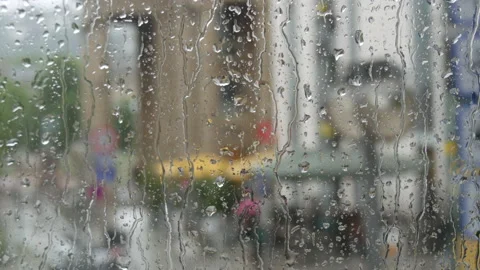 Rain on glass of a bus or car. Raindrops run down the window. Background of a Stock Footage 207911334
