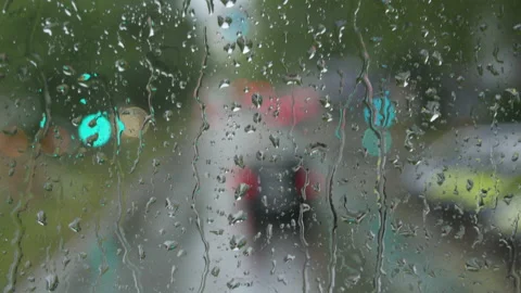 Rain on glass of a bus or car. Raindrops run down the window. Background of a Stock Footage 207929245