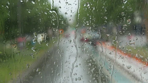 Rain on glass of a bus or car. Raindrops run down the window. Background of a Stock Footage 207934485