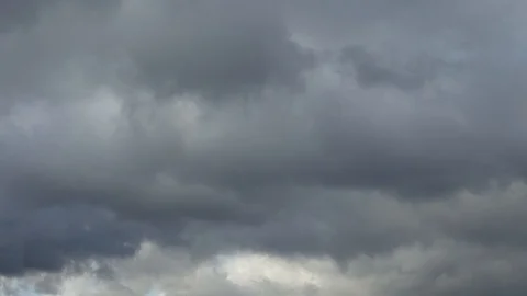 Rain gray fluffy clouds float across the sky Stock Footage 128279070