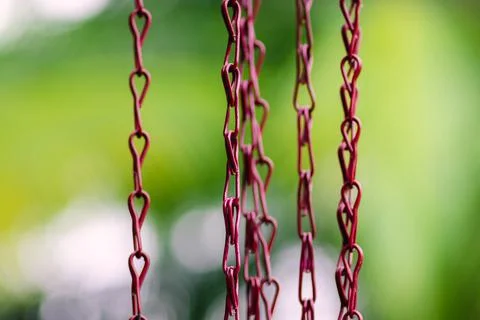 Rain gutter chains close up, controls the downpour of rainwater from the pipe Stockfoto's